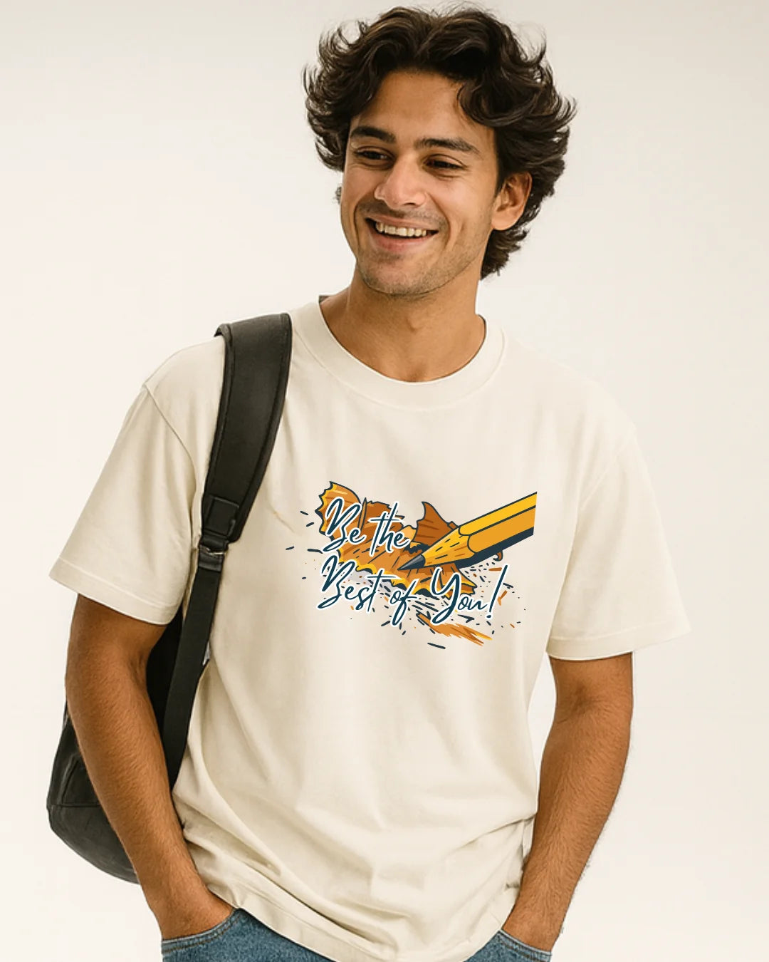 Man wearing a white t-shirt with a graphic design on a plain background