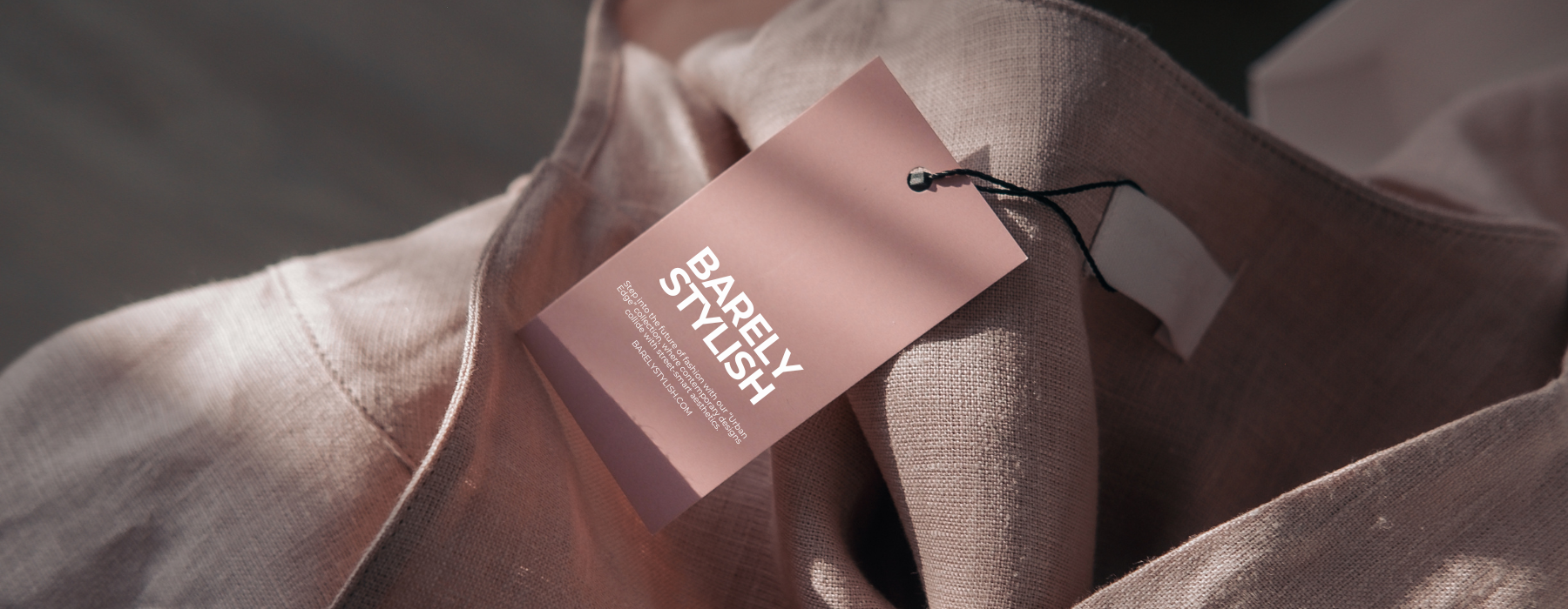 Barely There tag on a piece of fabric with a blurred background