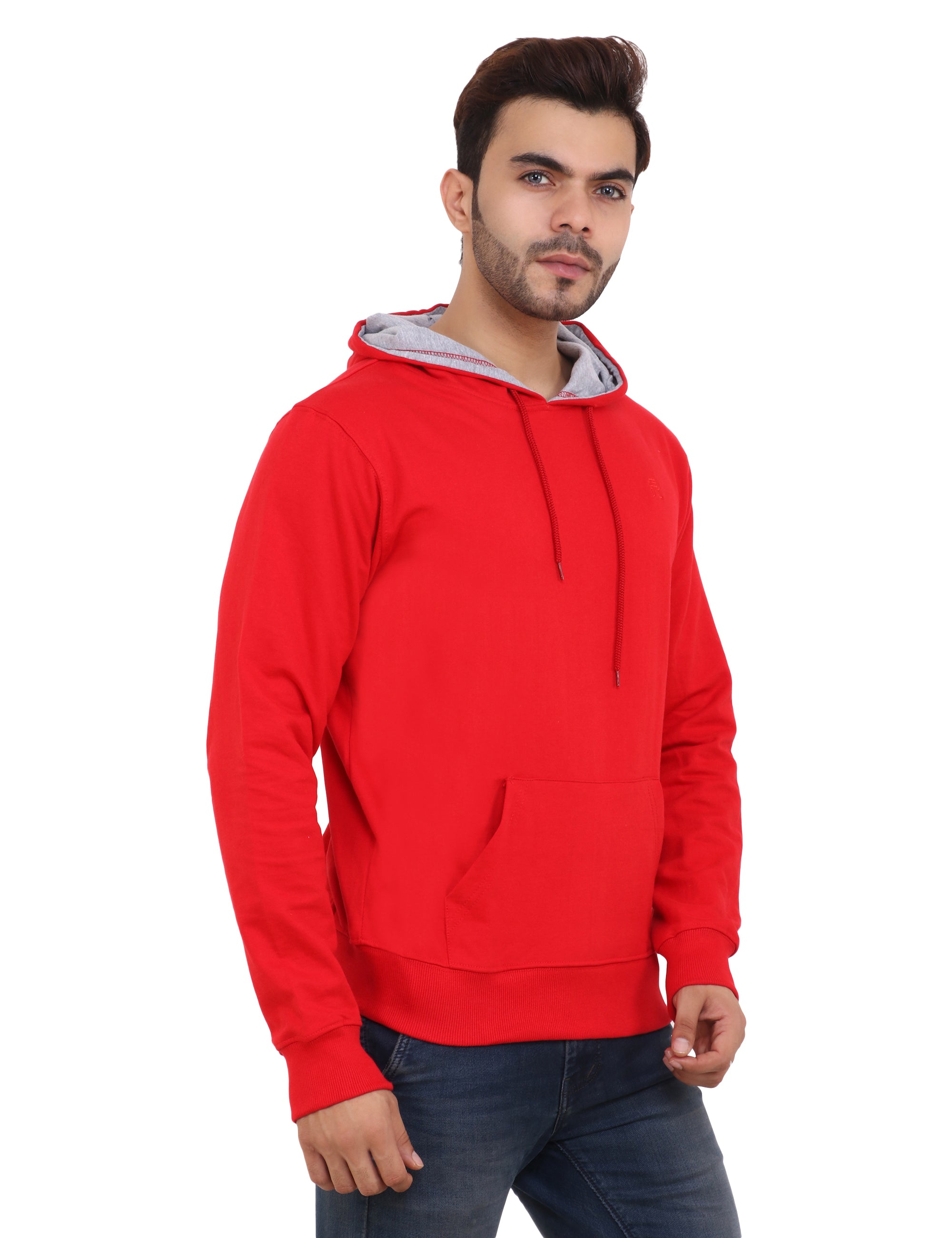 A man wearing a crimson red cotton blend hoodie with a hood, paired with a grey inner hoodie, and blue jeans.