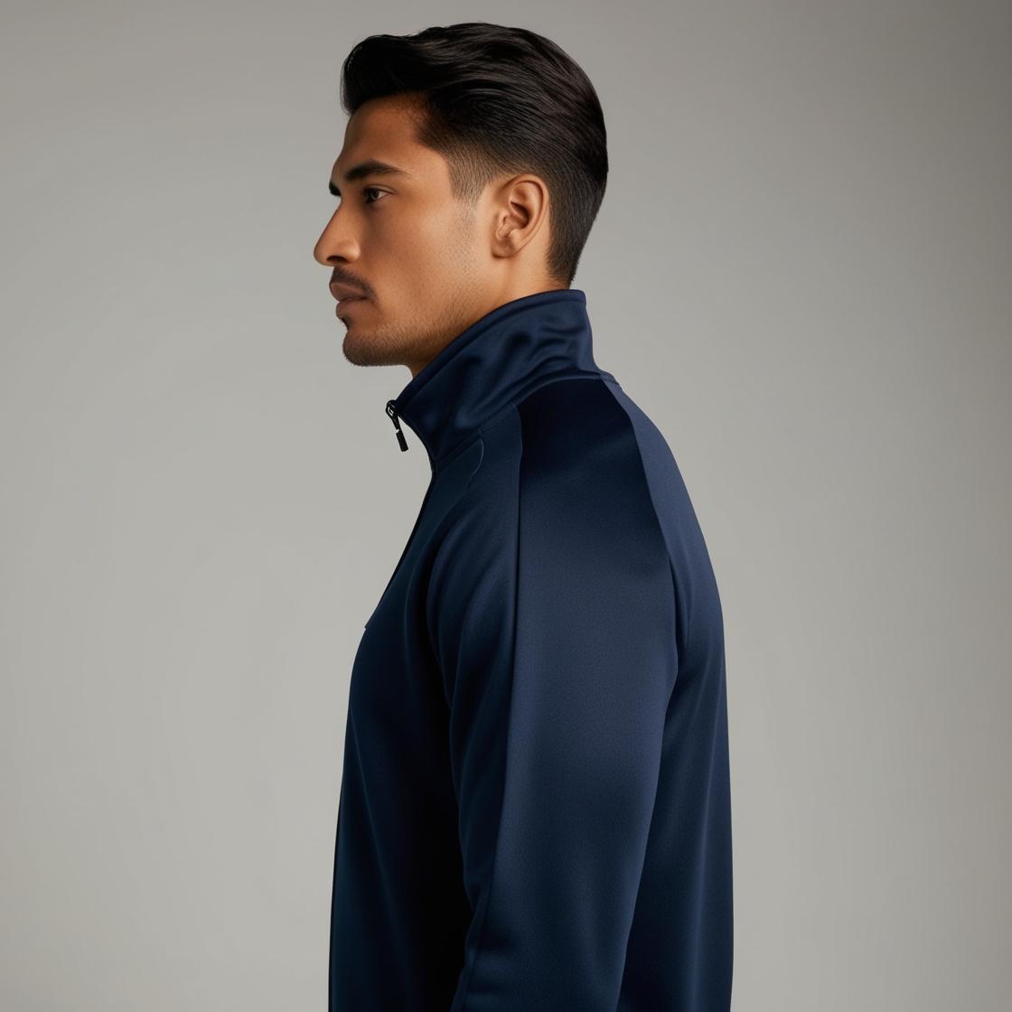 Side View of Model Wearing Navy Blue Track Suit.