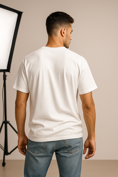 Man wearing a plain white t-shirt and blue jeans back profile.