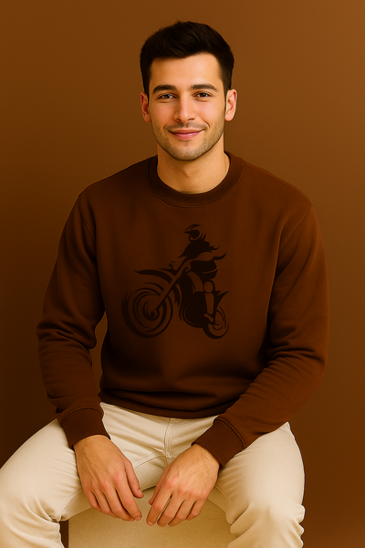 Man wearing a brown sweatshirt with a graphic design on a brown background