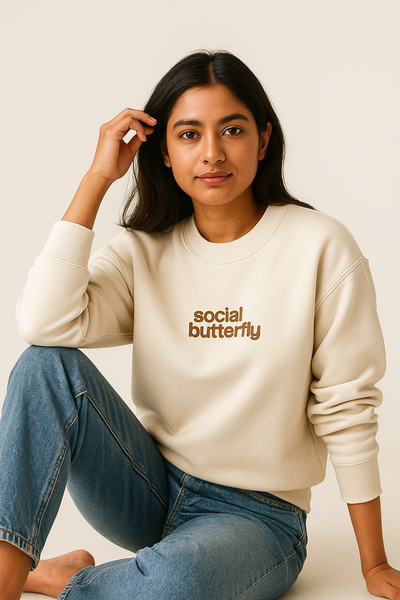 Cream sweatshirt with 'social butterfly' text.
