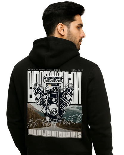 Man wearing a black hoodie with a detailed graphic design on the back against a white background