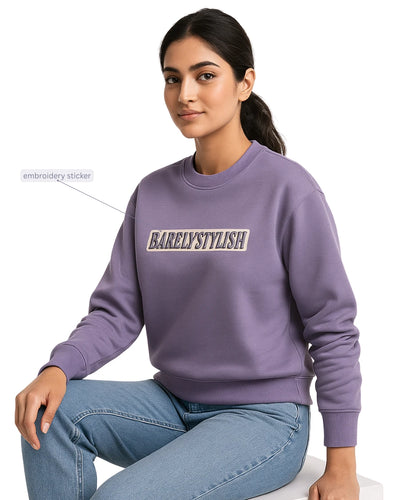Women wearing a purple sweatshirt with 'BARELY STYLISH' text.