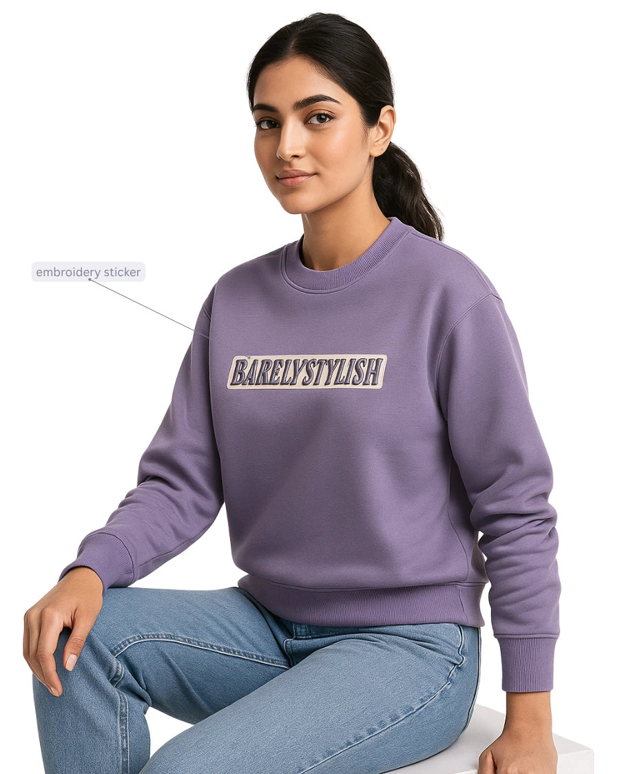 Women wearing a purple sweatshirt with 'BARELY STYLISH' text.