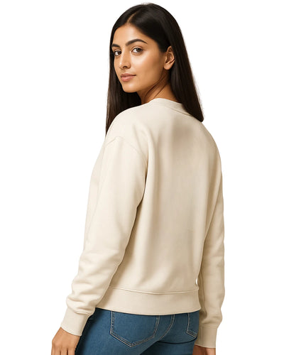 Woman wearing a beige sweatshirt on a white background