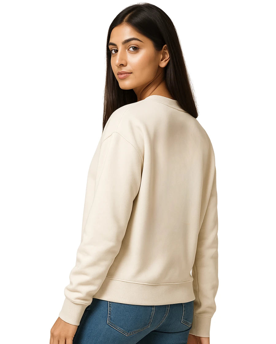 Woman wearing a beige sweatshirt on a white background