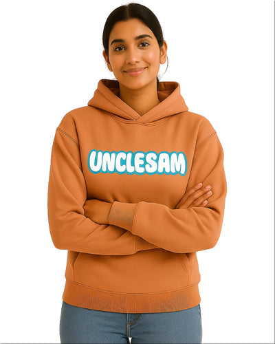 Person wearing a brown hoodie with 'UNCLESAM' text on a white background
