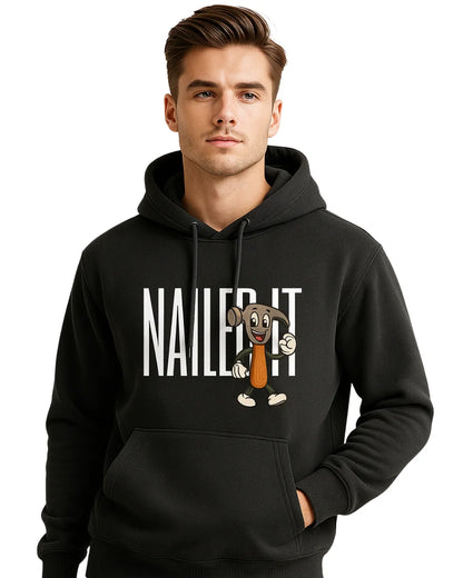 Man wearing a black hoodie with a cartoon character and 'NAILED IT!' text.