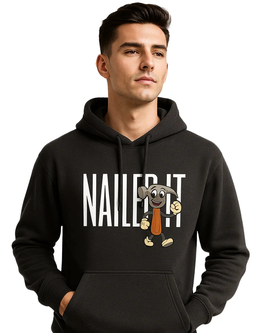 Man wearing a black hoodie with a cartoon character and 'NAILED IT!'.