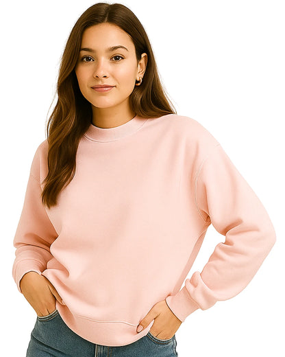 Woman wearing a light pink sweatshirt.