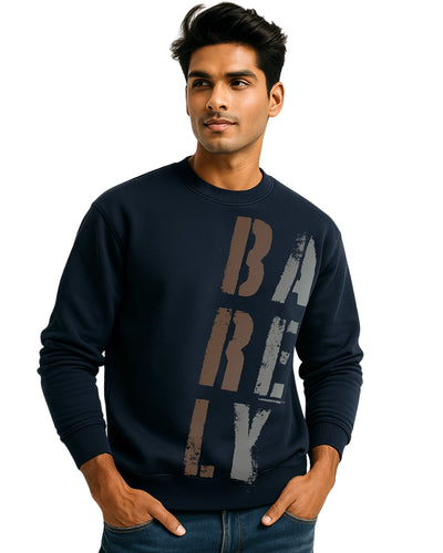 Man wearing a navy blue sweatshirt with 'BARELY' text on a white background