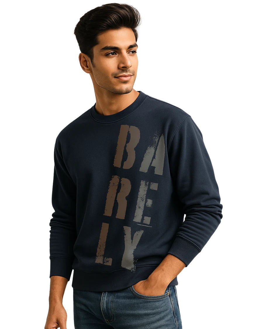 Man wearing a navy blue sweatshirt with 'BARELY' text on a white background