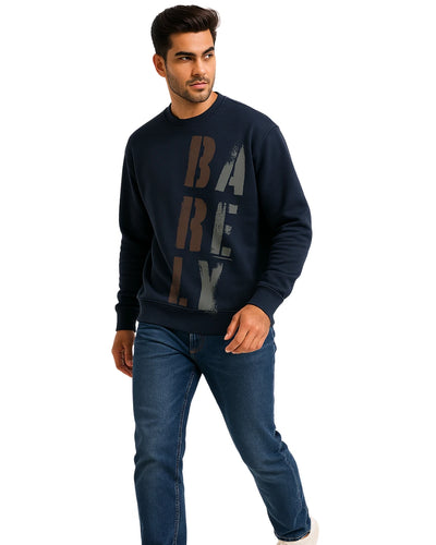 Man wearing a navy blue sweatshirt with 'BARELY' printed on it against a white background