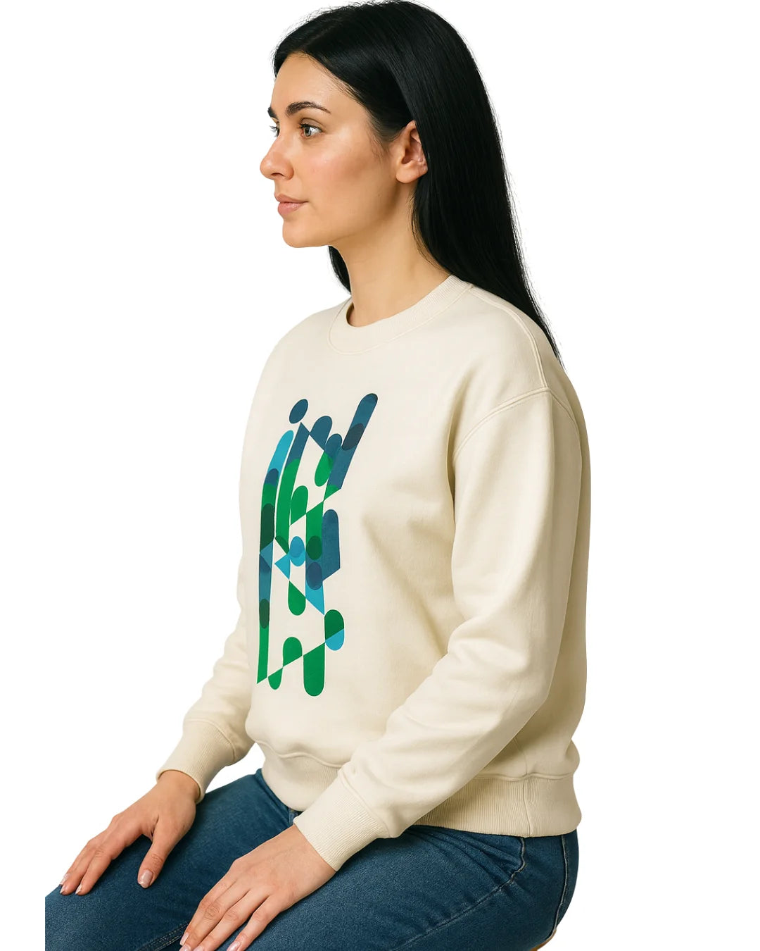 Woman wearing a cream sweatshirt with a blue and green abstract design