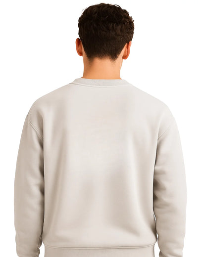 Person wearing a light gray sweatshirt on a white background
