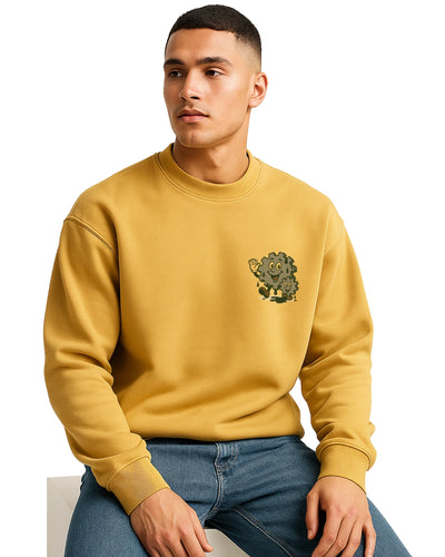 Man wearing a mustard yellow sweatshirt with a small graphic.