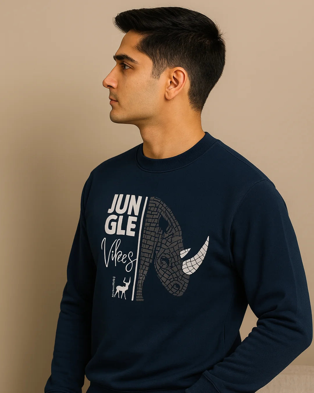 Man wearing a navy blue sweatshirt with 'Jungle Vibes' graphic on a beige background