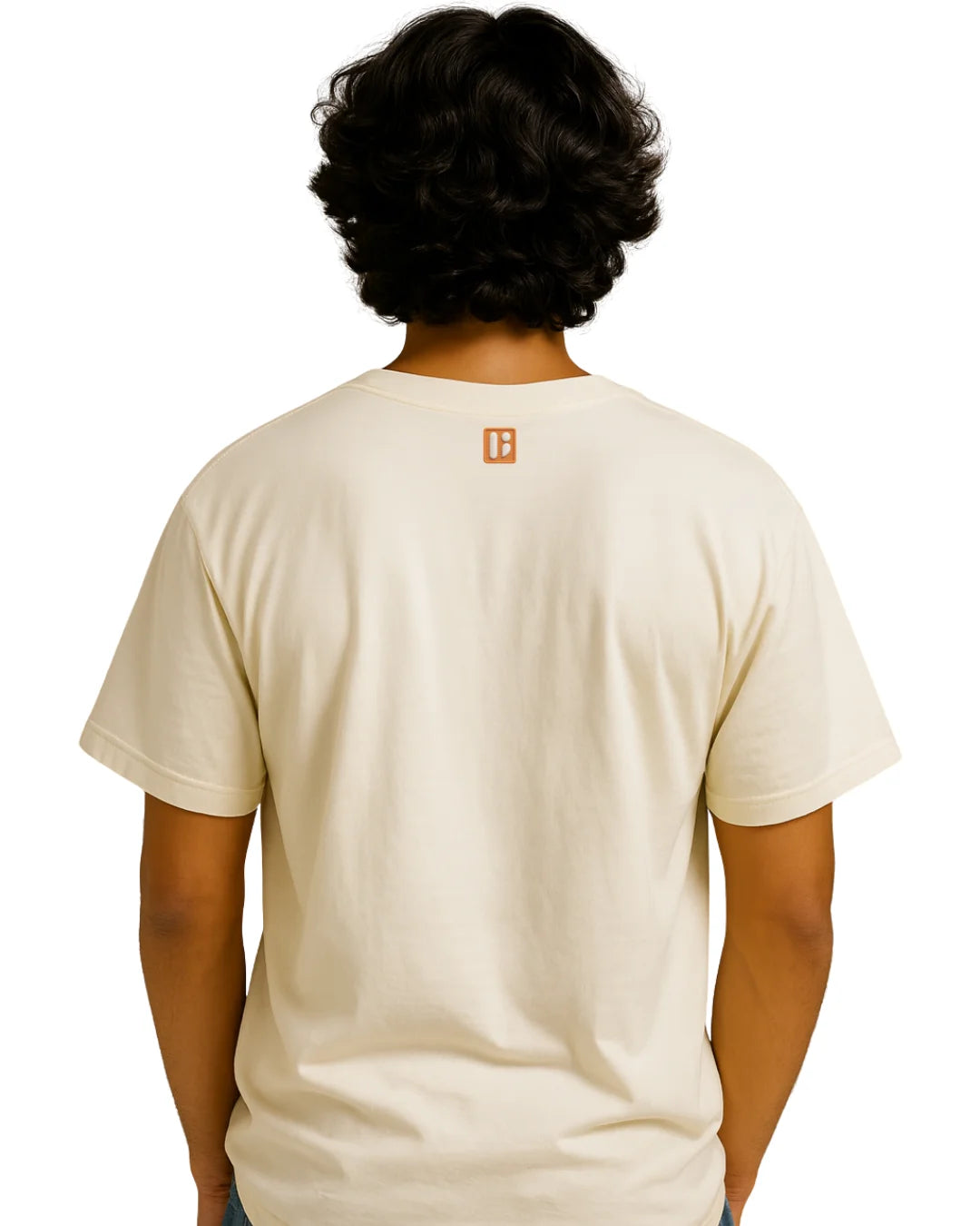 Person wearing a beige t-shirt with a logo on the back against a white background