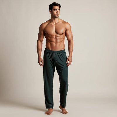 A man wearing dark green cotton pyjama with a relaxed fit and side pockets.