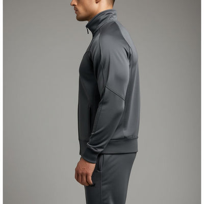 Side View of A male model wearing a dark grey tracksuit with a full zipper and standing collar.